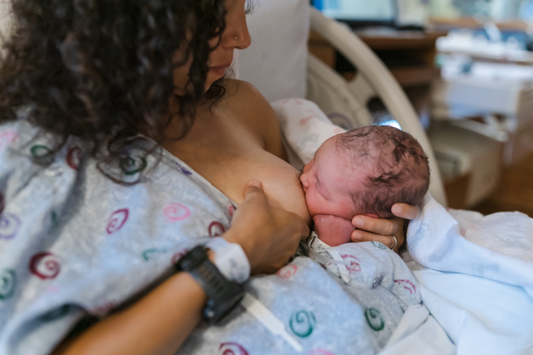 Newborn baby breastfeeding at the hospital